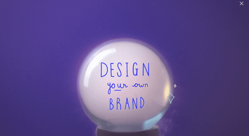 crystal ball with words 'design your own brand' seen on top of purple backdrop